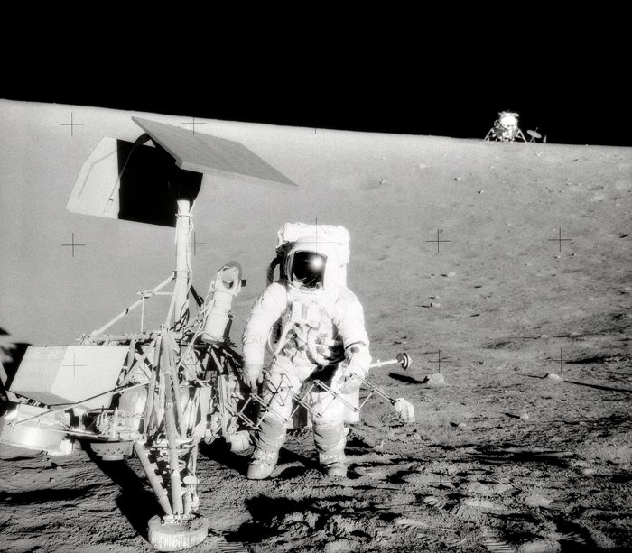 Space History Photo: Conrad and Surveyor on the Slope of a Crater